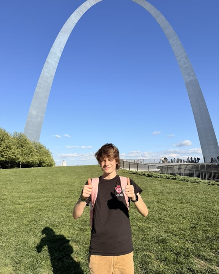 Henry Van Ness, Founder and CEO of Scoutly, standing beneath the Gateway Arch